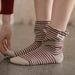 Women's 2025 Fall/Winter New Color-Block Striped Suede Mid-Calf Socks_voghion.com
