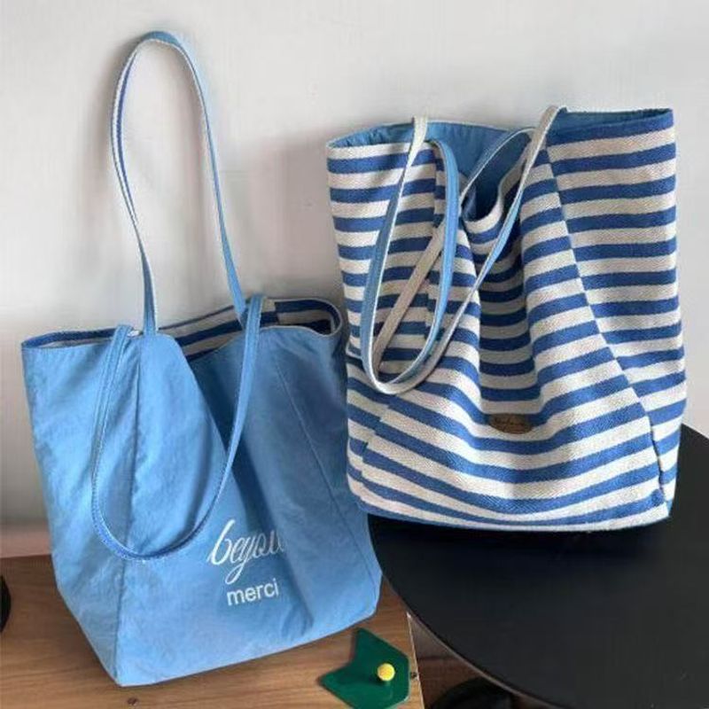 Borsa a tracolla casual grande capacità per studentessa, stile coreano, in tela a righe estive 2025, per donna_voghion.com