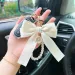 Y2K Band Bowknot Perlen Anhänger Charm Schlüsselanhänger Elegantes Perlenarmband Schlüsselanhänger Süße Kette Handy Schlüsseltasche Behänge_voghion.com