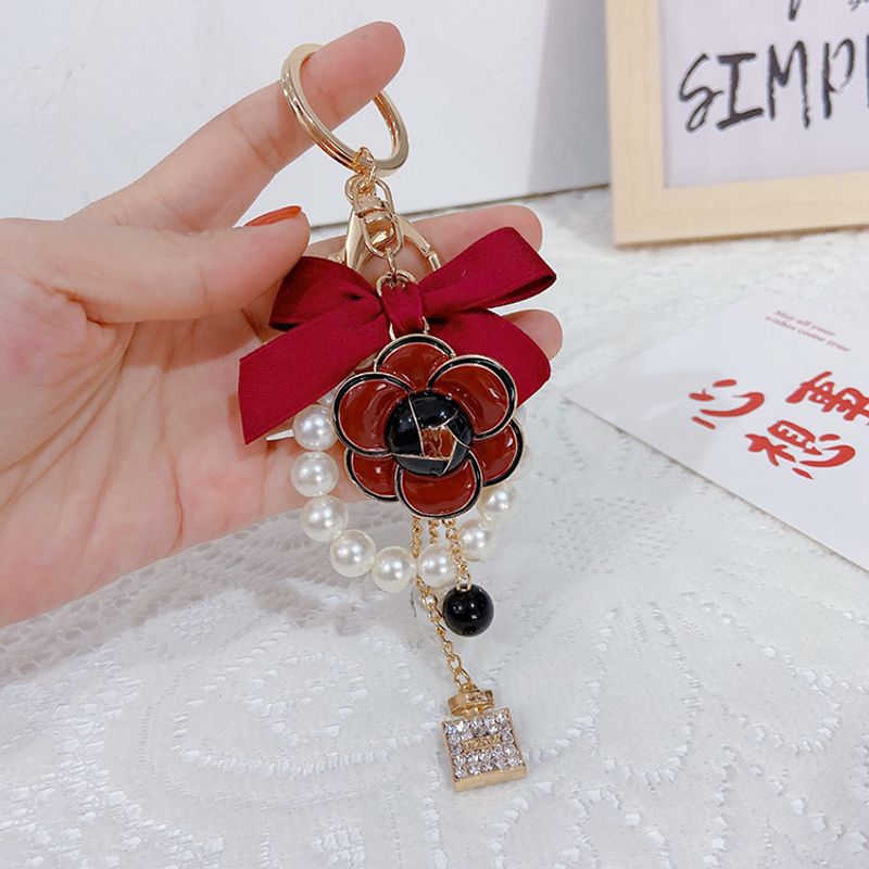 Creative Drip Oil Camellia Fashion Bow Pearl Chain Keychain Women's Bag Pendant Trendy_voghion.com