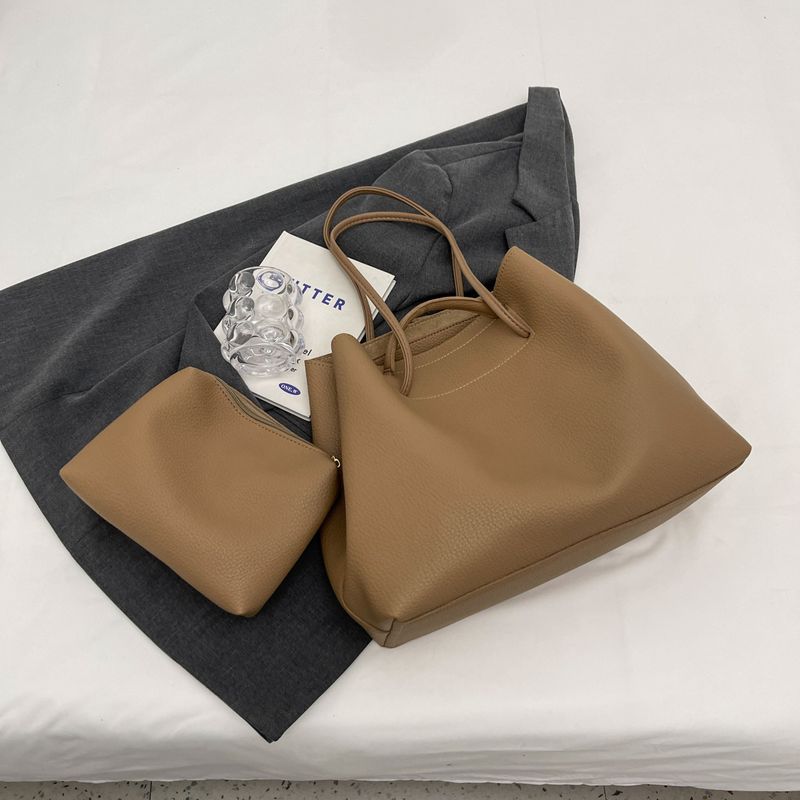 Large capacity mother and child for women 2024 new style temperament personalized hand-held shoulder commuting armpit_voghion.com