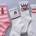 Unisex Socks female long tube ins tide high appearance level Sen department middle tube student white word mother and daughter grow socks female_voghion.com