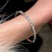 A niche design with a high-end cat's eye stone snake shaped opening sparkling diamond texture bracelet, women's light_voghion.com
