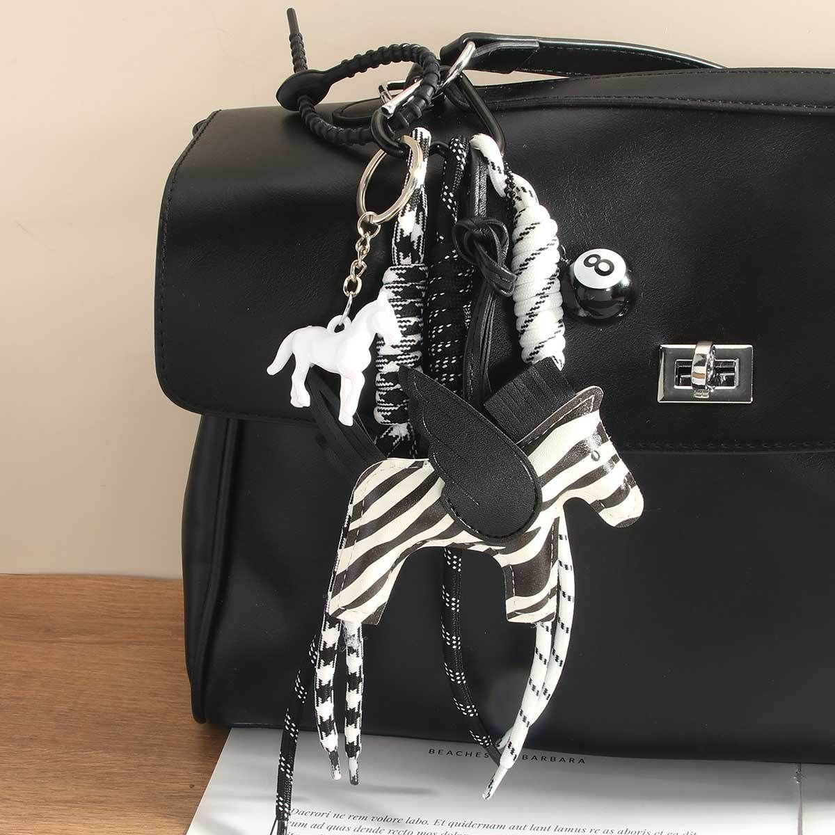 Whimsical Zebra-Print Pony Keychain – Stylish PU Leather Charm With Black Braided Rope (Maximalist Bag Accessory)_voghion.com