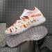 New high top football shoes for men and women seamless flying knitting long nail shoes broken nails grass professional training shoes_voghion.com