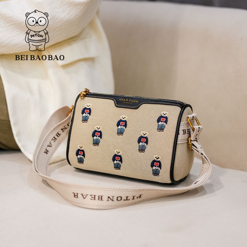 Borsa da donna in tela con tracolla larga e ricamo a contrasto di colore_voghion.com