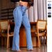 Pantaloni in denim svasati attillati elasticizzati con bottoni a vita alta da donna_voghion.com