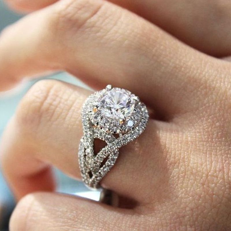 Cao Shi's new hollowed out full diamond zircon engagement ring inlaid with topaz for women_voghion.com