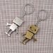 Portachiavi in bronzo a forma di robot, portachiavi in argento a forma di cartone, portachiavi a forma di omino di cartone, ciondolo chiave regalo Aleng_voghion.com
