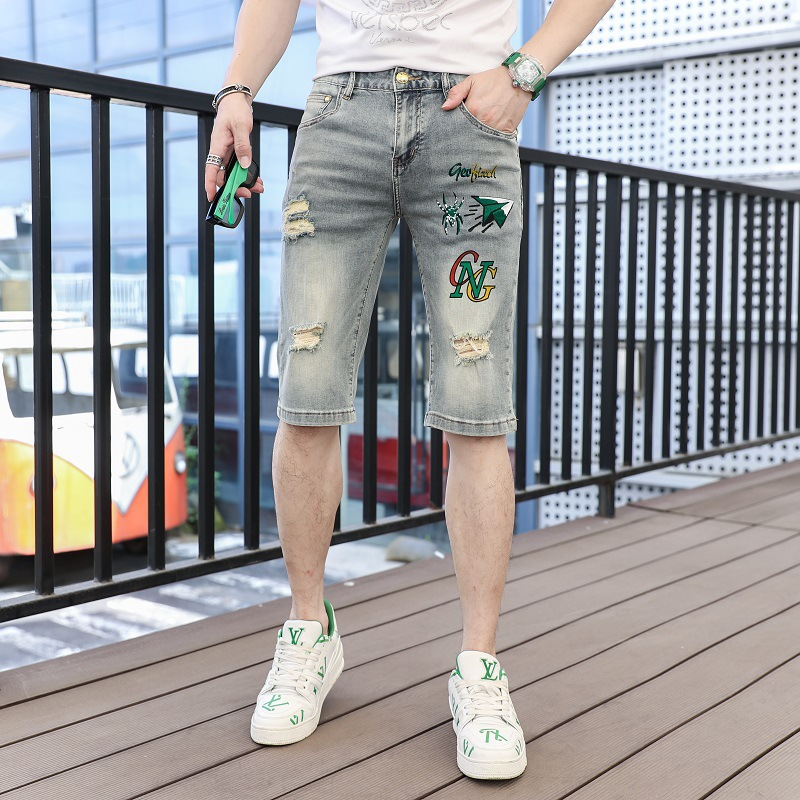 Abbigliamento da uomo Pantaloncini in denim stampato blu pantaloni quarti casual tendenza personalità strappati pantaloni da cavallo mendicante da uomo_voghion.com