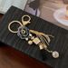 Koreanischen Stil Kamelie Quaste Schlüsselanhänger Metall Schlüsselanhänger Tasche Anhänger Auto Exquisite Geschenk_voghion.com