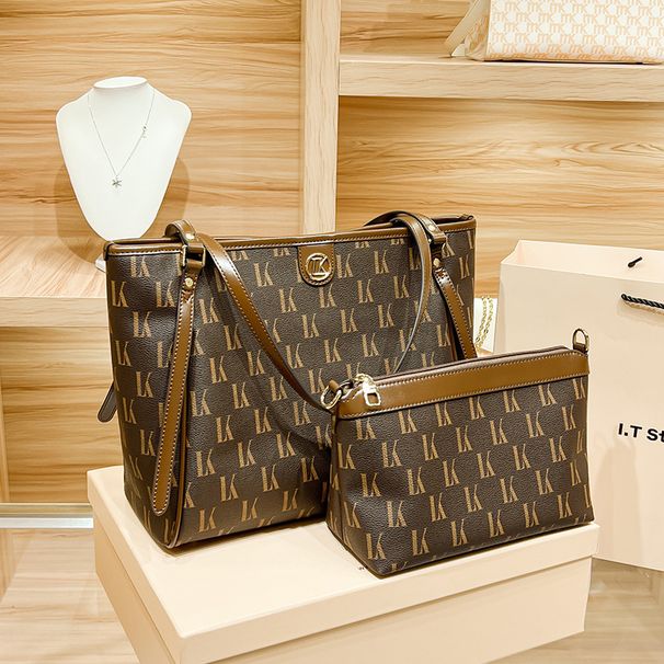 Hong Kong minimalistische leren tas voor dames capaciteit 2024 nieuwe veelzijdige woon-werkverkeer schoudertas, grote tas_voghion.com