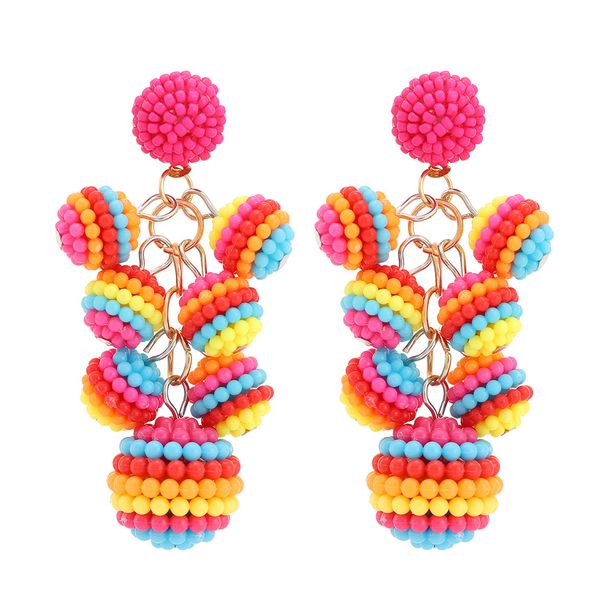 Orecchini con perline di riso fatti a mano in stile etnico con ciondolo a palla lunga bohémien per donna_voghion.com