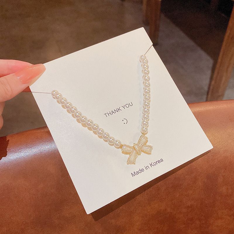 Collier de perles élégant pour femme, style ins, design de niche de luxe léger, collier de clavicule à nœud polyvalent_voghion.com