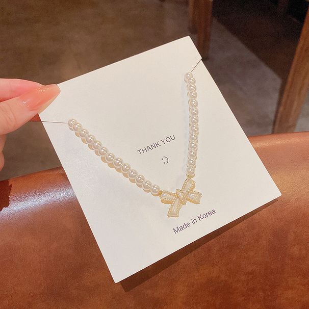 Collier de perles élégant pour femme, style ins, design de niche de luxe léger, collier de clavicule à nœud polyvalent_voghion.com