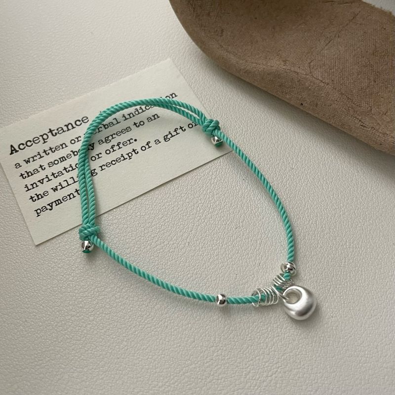 Braccialetto con ciondolo intrecciato a forma di borsa portafortuna in argento puro da donna | Design raffinato di nicchia di lusso leggero con atmosfera di alta qualità_voghion.com