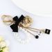 Korean Creative New Drip Oil Mountain Camellia Keychain Exquisite Bow Pearl Chain Bag Hanging Accessories_voghion.com
