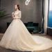 Champagne Lace Long Sleeve Wedding Dress With Cathedral Train, Plus Size Bridal Gown For Elegant Bride, Flowy A-Line Silhouette_voghion.com