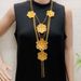 Set di orecchini e collana Dubai Long con più strati di fiori placcati in oro_voghion.com