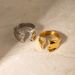 Anello in acciaio al titanio con apertura ondulata intarsiata in oro e diamante, neutro, freddo e vento_voghion.com