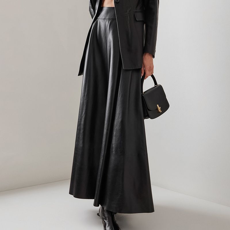 Jupe en cuir PU 2023 automne et hiver nouvelle jupe longue noire haut de gamme transfrontalière tempérament de banlieue européen et américain vêtements pour femmes_voghion.com