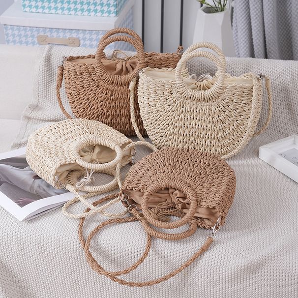 Borsa da donna estiva abbinata, semplice e quotidiana, a secchiello rotondo a forma di Yuanbao, intrecciata a mano in paglia tinta unita._voghion.com