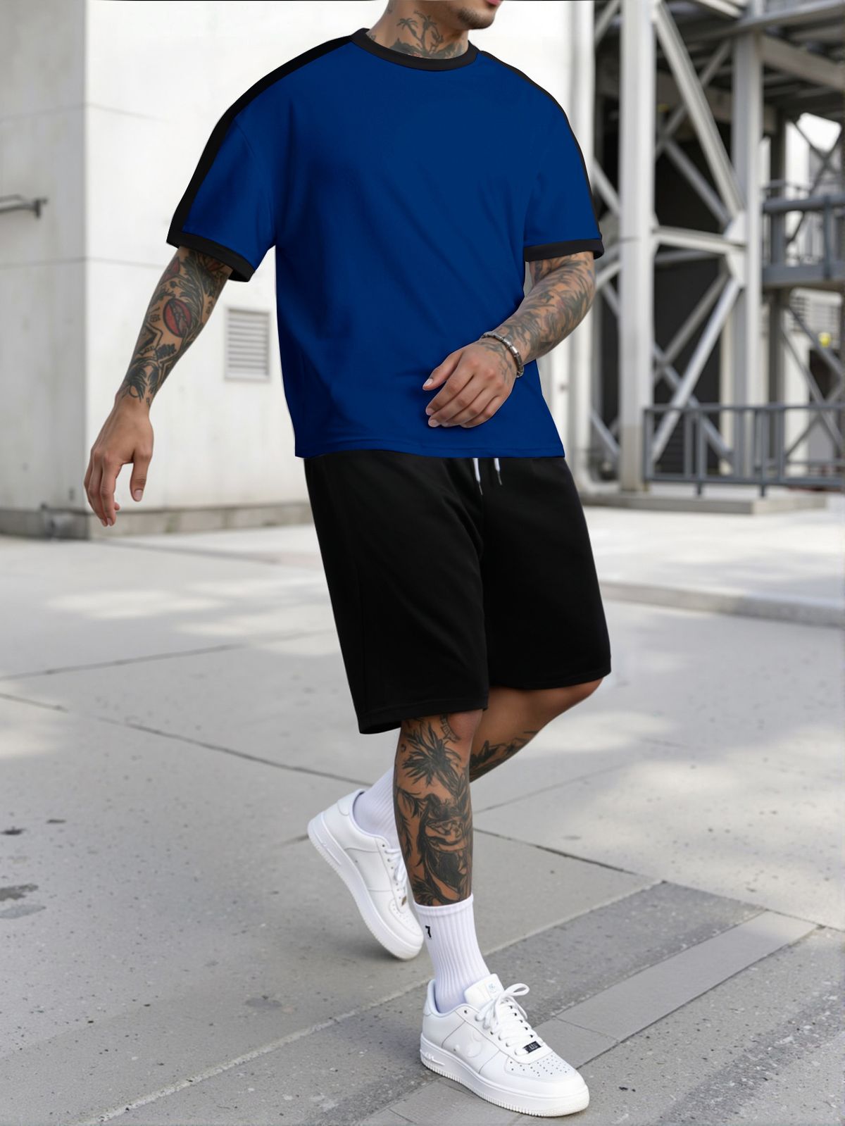 Conjunto de camiseta esportiva masculina com gola redonda e manga curta combinando com a cor_voghion.com