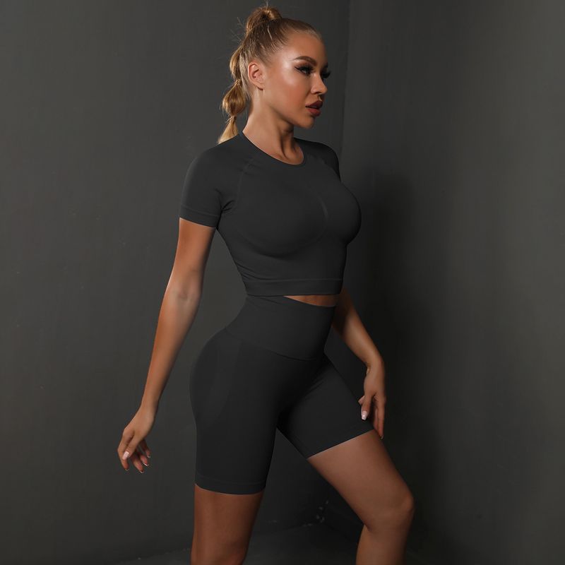 Dameskleding naadloze perzikkleurige kont effen kleur hoogelastische yoga shorts met korte mouwen hardloopsport fitness tweedelige set_voghion.com