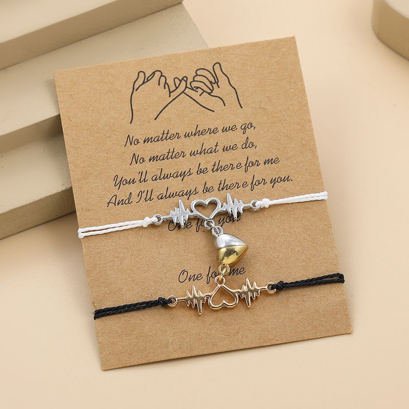 Braccialetto magnetico con magnete a forma di cuore intrecciato in bianco e nero, per coppia, con elettrocardiogramma_voghion.com