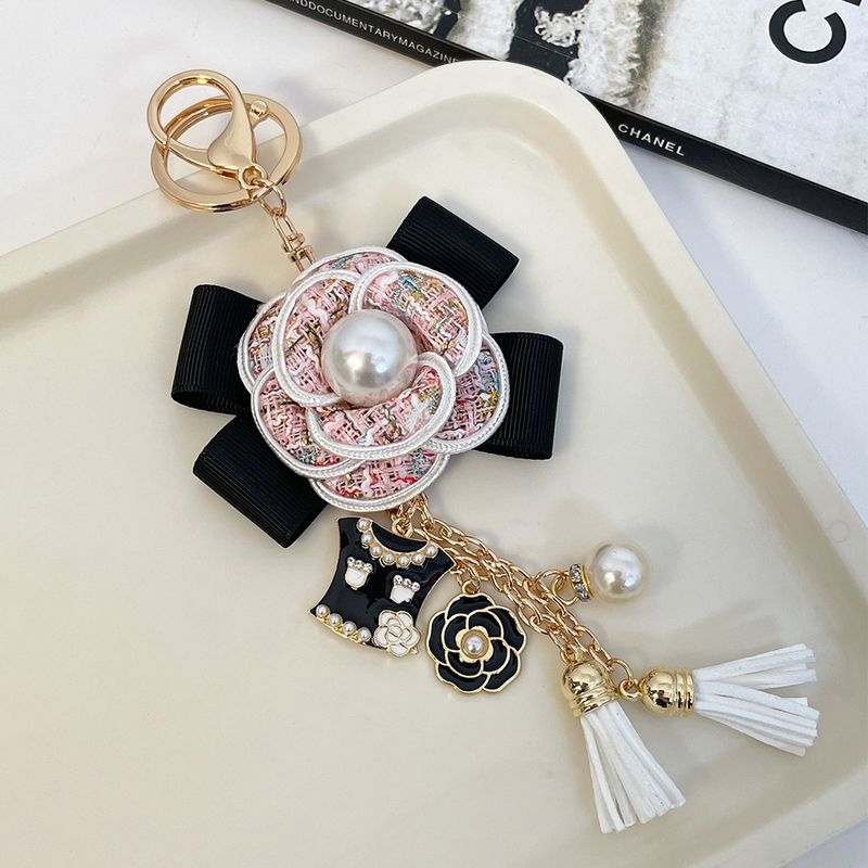 Korean version new creative camellia flower tassel car keychain women's bag small gift pendant_voghion.com