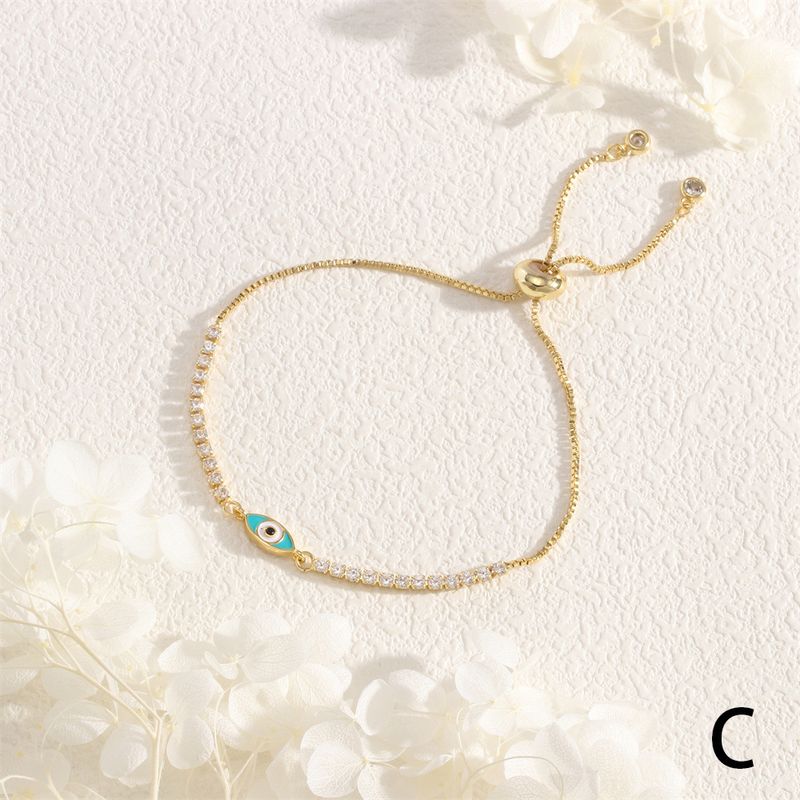 New cross-pin copper dripping Devil's Eye bracelet small fish Palm blue eye zircon pull bracelet female in stock_voghion.com