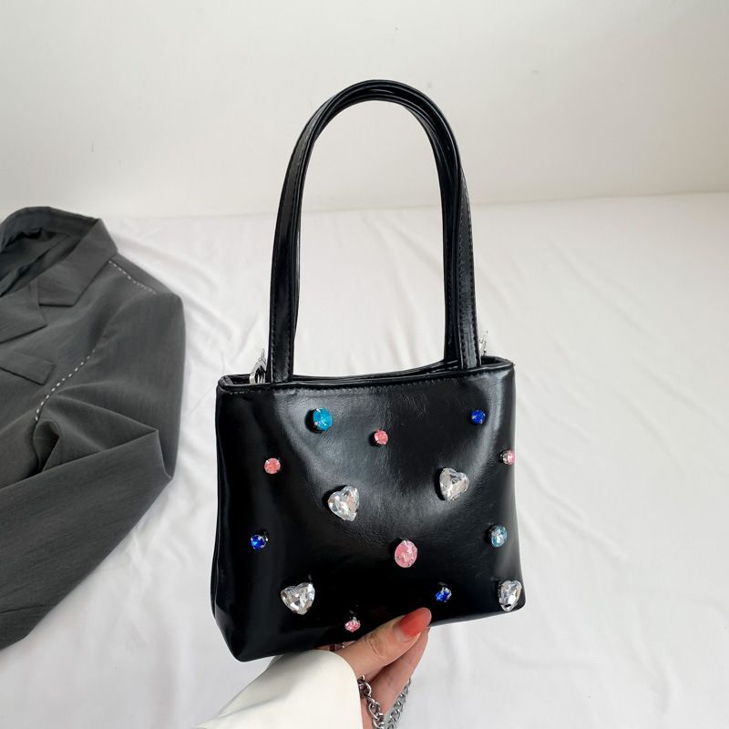 Sac de célébrité Internet super chaud de pierres précieuses sac pour femme 2023 nouveau sac seau portable à clous de diamants à la mode style étranger chaîne oblique à épaule unique_voghion.com