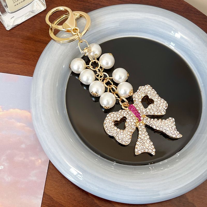 Handmade Series Pearl String Bow Shape Keychain Pendant Metal Diamond Bag Pendant Gift_voghion.com