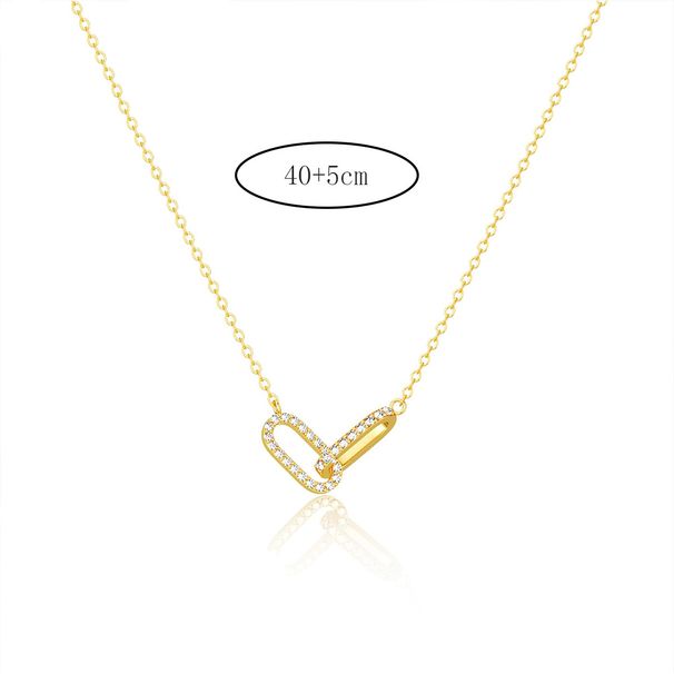 Collana da donna con pendente versatile a forma di graffetta, in rame elettroplaccato in oro 14k, con spilla in zirconio._voghion.com
