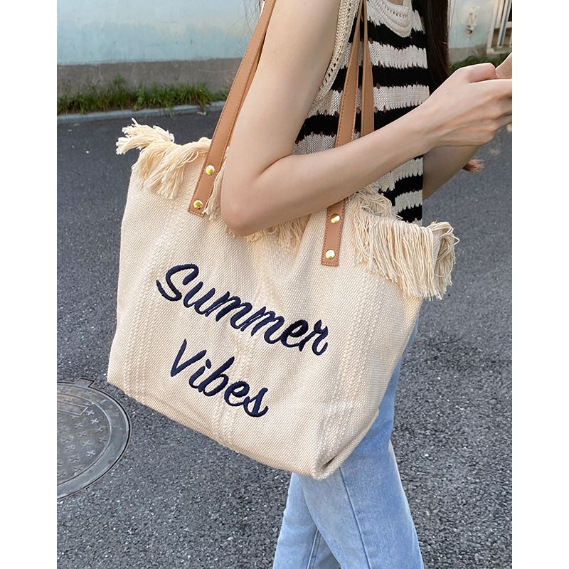 new tassel Korean letter canvas bag female large capacity simple commuting student shoulder tote bag_voghion.com