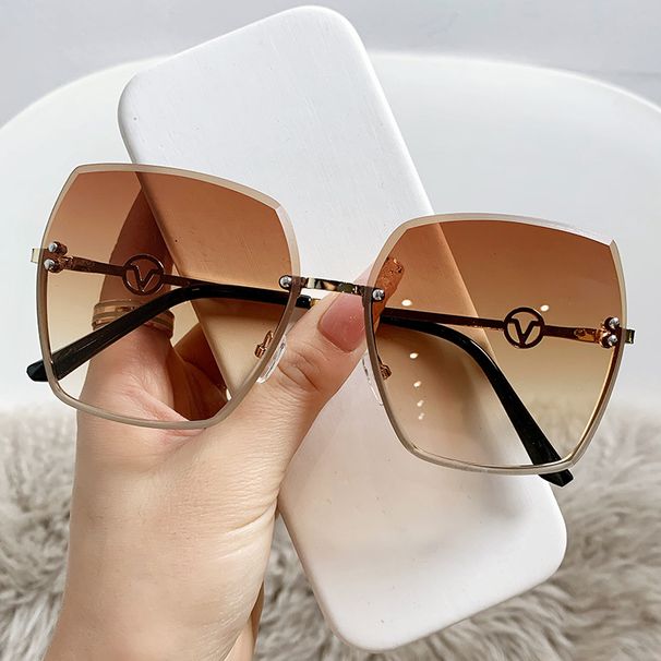 New frameless cut edge women's fashion, with a large metal frame and gradient purple light sunglasses for driving_voghion.com