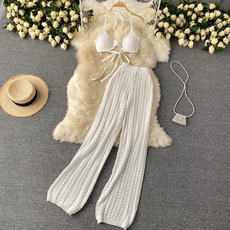 Set da vacanza al mare da donna, top sexy a tubino con allacciatura al collo, top con lacci, pantaloni a gamba larga in maglia cava, set in due pezzi_voghion.com