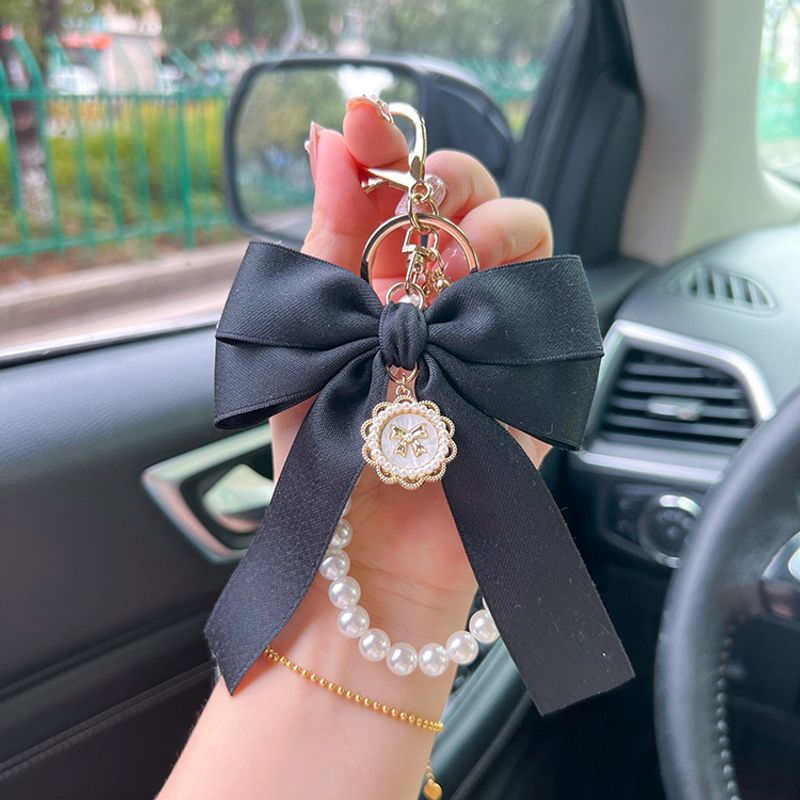 Creative Bowknot Pearl Chain Women's Fashion Bag Pendant Car Keychain Personalized Fluttering Bow Tie_voghion.com