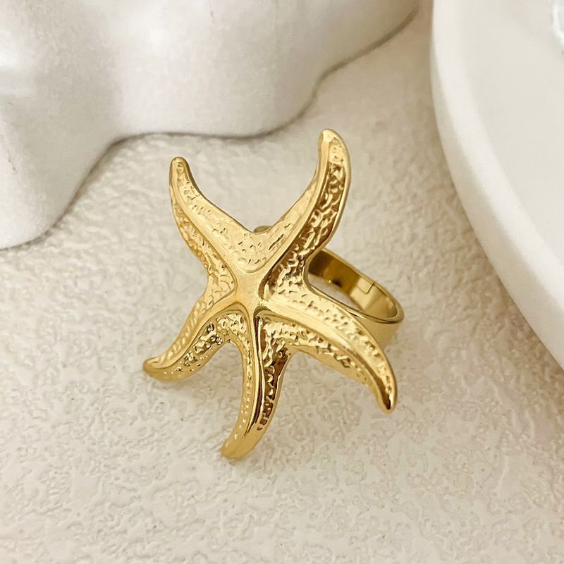 JINYVE - Bague ouverte en acier inoxydable plaqué or 14 carats en forme d'étoile de mer - Accessoire amusant pour homme et femme - Réglable - Grande taille_voghion.com