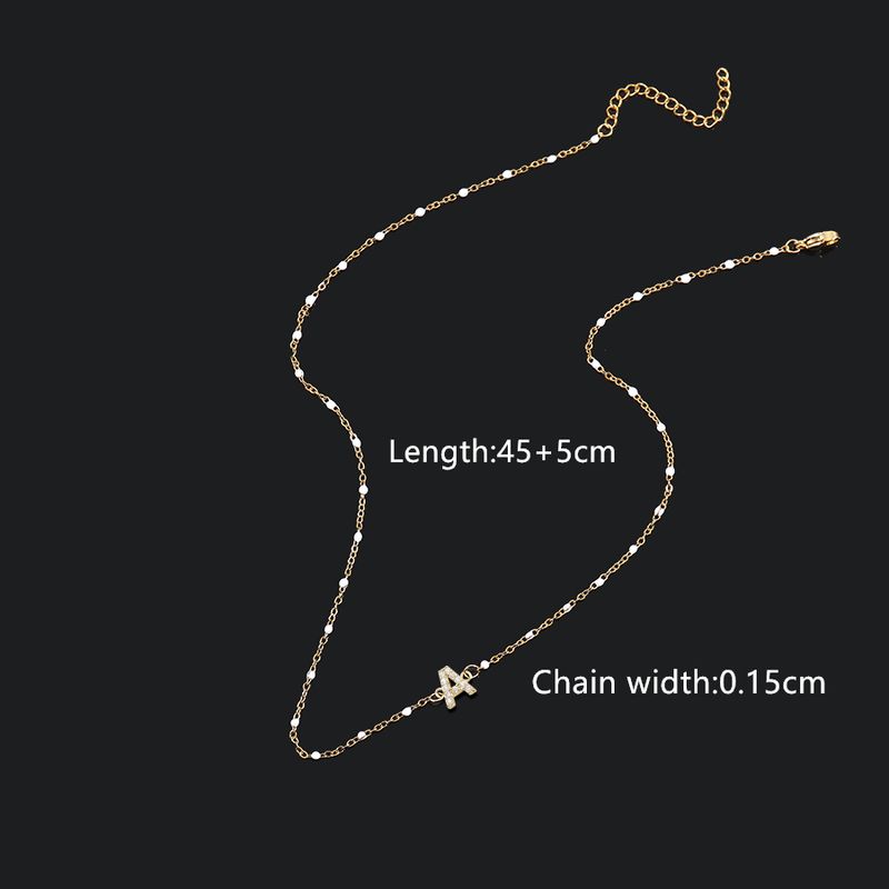 Collana con ciondolo a forma di lettera intarsiata in rame e zircone in acciaio inossidabile 201_voghion.com
