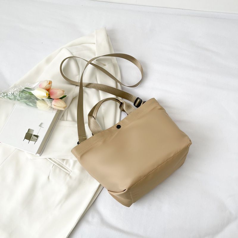 2022 New Large Capacity Women's Nylon Cloth Korean Edition Small Fresh and Simple PU Handheld Bag_voghion.com