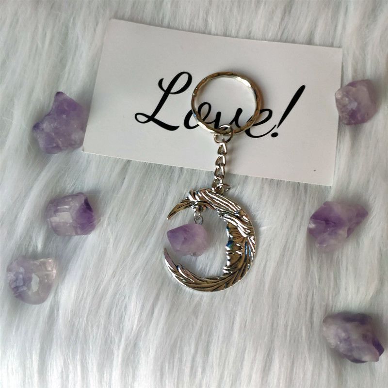 Llavero de luna de cristal morado con material educativo y de oficina_voghion.com