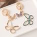 Creative Cute Diamond-Encrusted Alloy Double Flying Butterfly Keychain Metal Women's Bag Pendant Key Ring Gift_voghion.com
