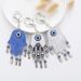 Creative Blue Eye Bag Pendant Devil's Eye Palm Metal Keychain Pendant_voghion.com