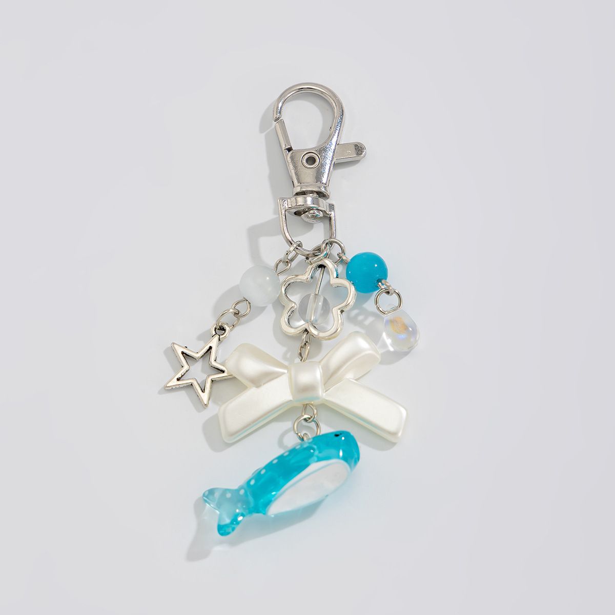 Portachiavi con ciondolo per borsa a forma di tartaruga marina con conchiglia di delfino in stile vacanza sull'oceano_voghion.com