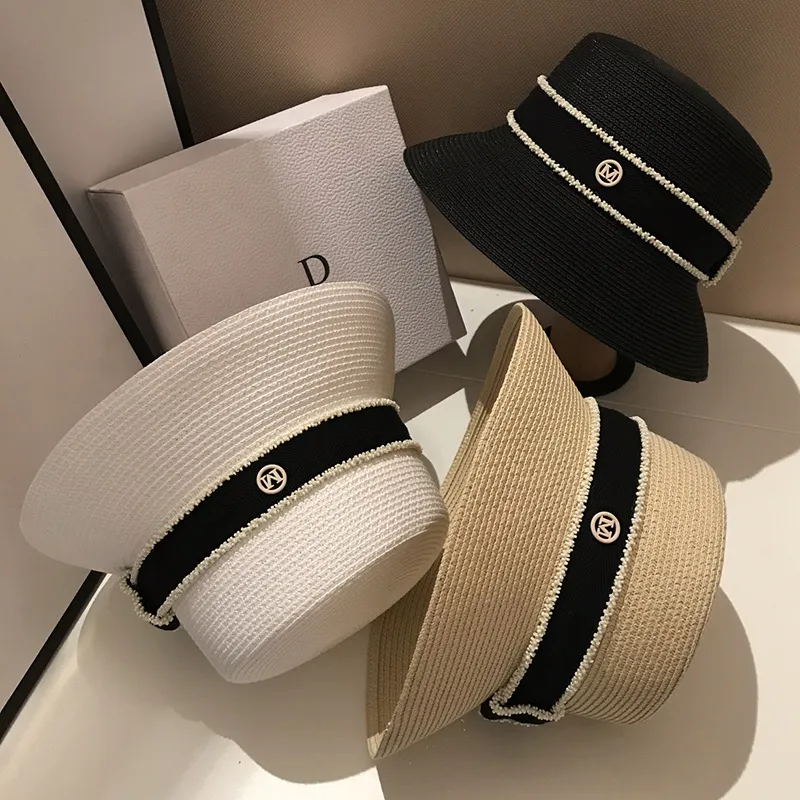 Gorąca sprzedaż Gorąca sprzedaż Nowe letnie słomkowe kapelusze przeciwsłoneczne dla kobiet Moda damska Płaskie rondo Wstążka Plażowa Czapka podróżna Chapeau Femme Kapelusz typu Bucket_voghion.com