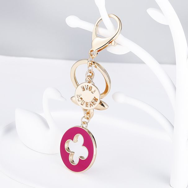 Modni novi ustvarjalni obesek za ključe s štirimi listi trave, kovinski intarziran diamant, avtomobilsko oglaševanje, darilo za dekliško torbo_voghion.com