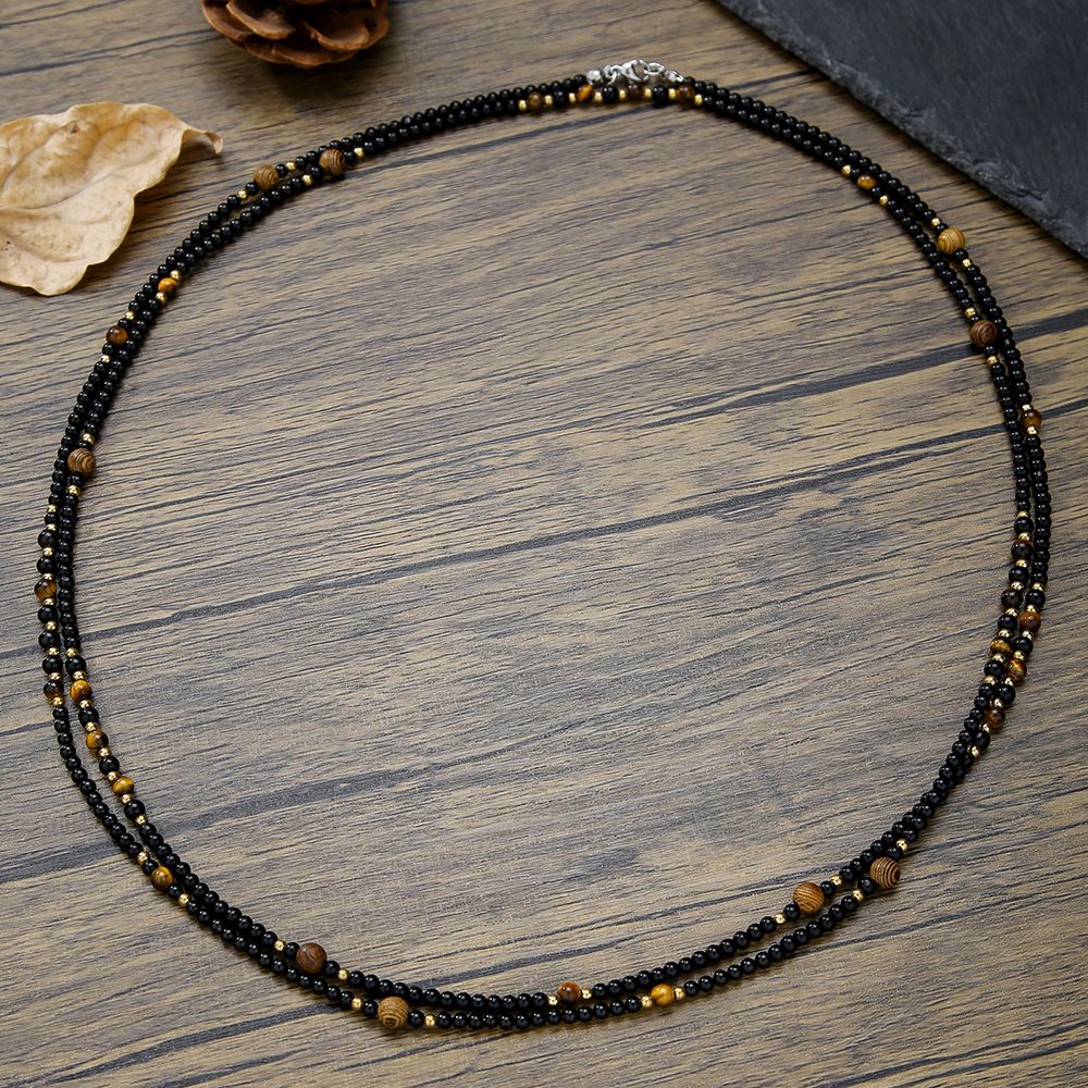 Collana con perline in oro piccole e sottilissime in agata nera e occhio di tigre, stile Fever, per uomo. Collana lunga con perline._voghion.com