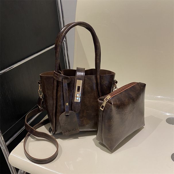 Borsa da pendolare minimalista Nuova borsa a tracolla con secchiello per acqua con fibbia a serratura casual da donna con una spalla di tendenza texture 2024_voghion.com