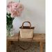 Borsa a secchiello in paglia testurizzata, piccola, da donna, da tenere a mano, nuova borsa a tracolla Niche, estate 2025_voghion.com